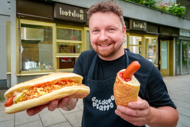 Kommt rum. Nach Kochbox, Kantine Nr. 2 und Fettboy ist Christian Hagen jetzt Hot-Dog-Verkäufer Nr. 1. Ketwurst in seiner Linken gibt es übrigens auch. Foto: PR/Vonovia André Wirsig
